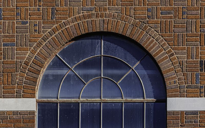 Arched window fitting